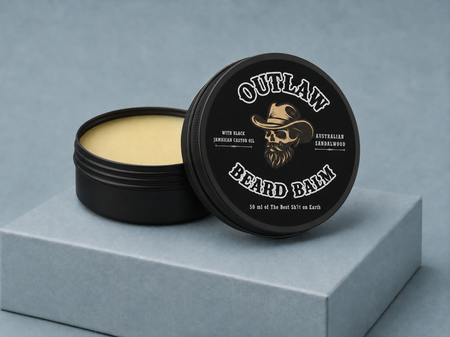 Outlaw Beard Balm container with lid open on a gray platform