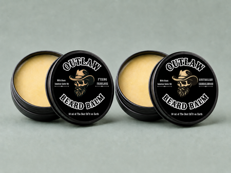 Four containers of Outlaw Beard Balm on a gray background