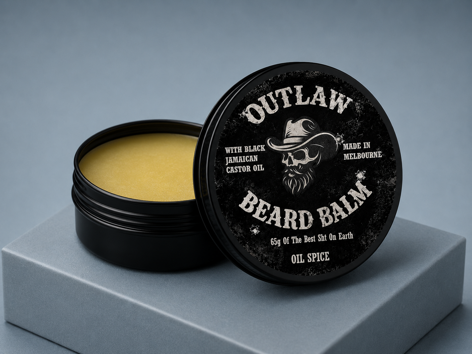 Outlaw Beard Balm container with lid open on a gray background