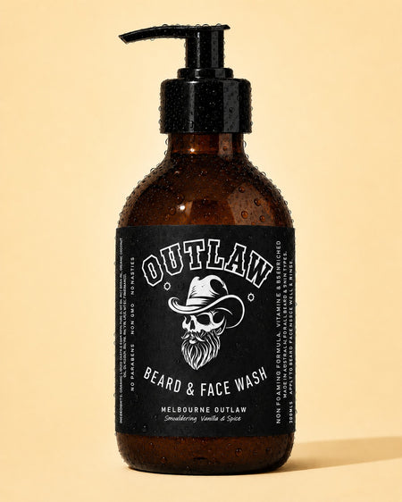 Brown bottle of 'Outlaw Beard & Face Wash' with a black label on a beige background
